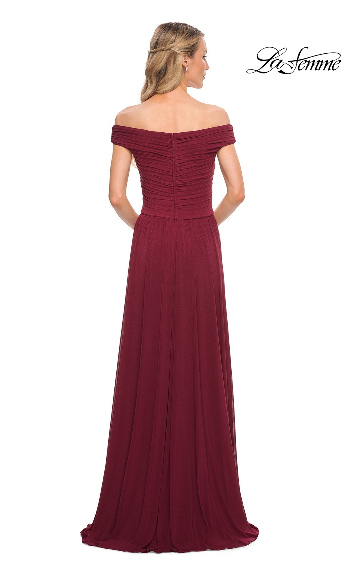 Woman in Long Formal Dress: La Femme 29168—an off-the-shoulder, floor-length burgundy gown with ruched detailing, A-line skirt, and zipper closure, seen from the back.
